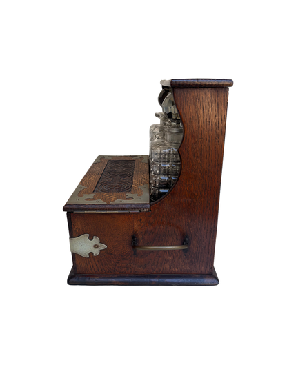 English Victorian Carved Oak Three-Bottle Tantalus and Games Compendium with Cut Glass Decanters, Circa 1880–1900