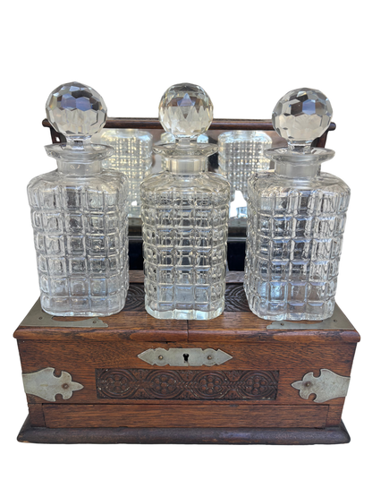 English Victorian Carved Oak Three-Bottle Tantalus and Games Compendium with Cut Glass Decanters, Circa 1880–1900