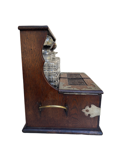 English Victorian Carved Oak Three-Bottle Tantalus and Games Compendium with Cut Glass Decanters, Circa 1880–1900