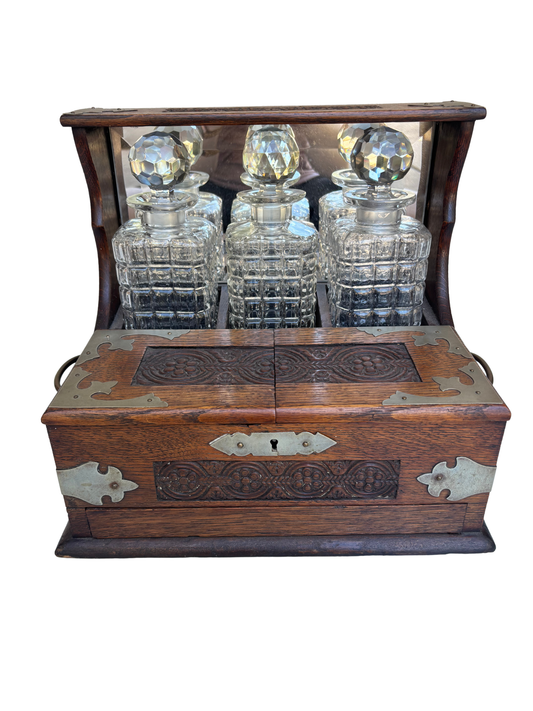 English Victorian Carved Oak Three-Bottle Tantalus and Games Compendium with Cut Glass Decanters, Circa 1880–1900