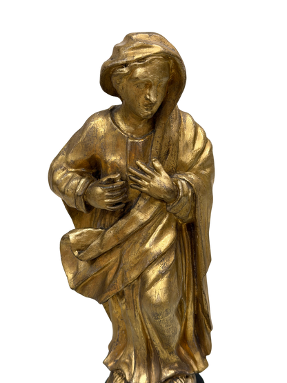 Continental Giltwood Figure of the Madonna Annunciata on Ebonized Pedestal